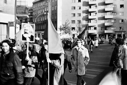 Marchers lit by sunlight.